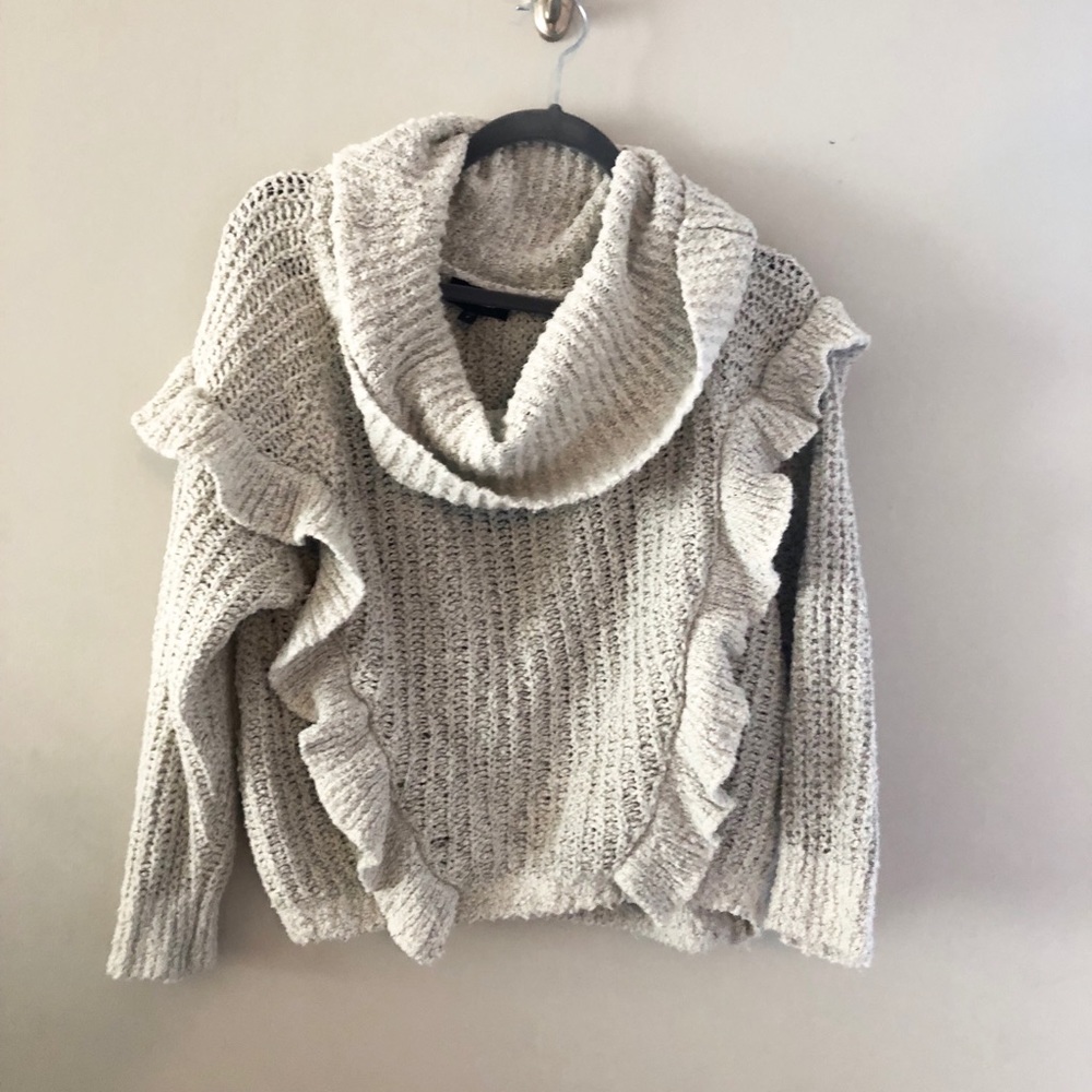Light sweater comes down to waist line